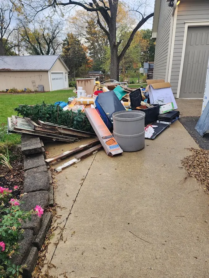Dumpster being loaded with debris for Roofing Dumpster Rental in Ellenville